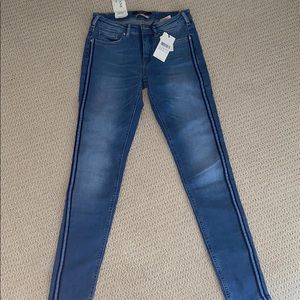 Blue skinny jeans with stripe down each leg